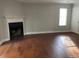 Cozy living room with a traditional fireplace and hardwood floors, perfect for relaxing and entertaining at 3980 Bayside Cir, Atlanta, GA 30340