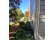 Side yard features green shrubbery and mature trees at 3980 Bayside Cir, Atlanta, GA 30340