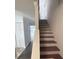 Carpeted stairway leading to the upper level, providing a seamless transition between floors at 3980 Bayside Cir, Atlanta, GA 30340