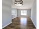 Bright dining area boasts modern lighting and wood floors at 434 Ridgetop Nw Dr, Acworth, GA 30102