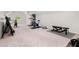 Spacious home gym equipped with various exercise machines and weights at 500 River Bluff Pkwy, Roswell, GA 30075