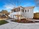 Home back elevation showcasing deck, screened porch, and backyard space at 1280 Pinyon Pl, Lawrenceville, GA 30043