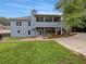 Backyard with covered porch and lush green lawn, perfect for outdoor enjoyment at 1280 Pinyon Pl, Lawrenceville, GA 30043