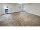 Carpeted basement area with a door to the outside at 1280 Pinyon Pl, Lawrenceville, GA 30043