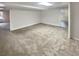 Spacious finished basement with neutral carpet, offering flexibility for various uses at 1280 Pinyon Pl, Lawrenceville, GA 30043