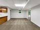 Finished basement area with cabinets, carpet flooring, and natural light at 1280 Pinyon Pl, Lawrenceville, GA 30043