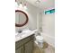 Bathroom featuring a decorative mirror and tub with shower at 1280 Pinyon Pl, Lawrenceville, GA 30043