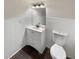 White bathroom with a single vanity, a modern faucet, and a toilet at 1280 Pinyon Pl, Lawrenceville, GA 30043