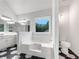 Bathroom featuring a soaking tub and elegant fixtures at 1280 Pinyon Pl, Lawrenceville, GA 30043