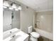 Bright bathroom with modern sink vanity, framed mirror and combination tub and shower at 1280 Pinyon Pl, Lawrenceville, GA 30043