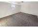 This bedroom features neutral paint and carpet, offering a blank canvas for personal touches and decor at 1280 Pinyon Pl, Lawrenceville, GA 30043