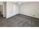 Neutral bedroom with plush carpet flooring, closet with folding doors, and ceiling fan at 1280 Pinyon Pl, Lawrenceville, GA 30043