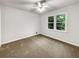 Cozy bedroom featuring a ceiling fan and large window at 1280 Pinyon Pl, Lawrenceville, GA 30043