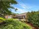 Traditional brick home with attached garage, landscaping, and curb appeal at 1280 Pinyon Pl, Lawrenceville, GA 30043