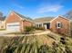 Charming brick home with a two-car garage and well-manicured front lawn at 1280 Pinyon Pl, Lawrenceville, GA 30043