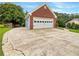 Detached garage with ample parking and large driveway; perfect for extra vehicles at 1280 Pinyon Pl, Lawrenceville, GA 30043