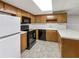 Well-equipped kitchen with modern appliances and ample countertop space at 1280 Pinyon Pl, Lawrenceville, GA 30043