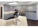Modern kitchen with stainless steel appliances and gray cabinets at 1280 Pinyon Pl, Lawrenceville, GA 30043
