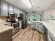 Updated kitchen with stainless steel appliances and granite countertops at 1280 Pinyon Pl, Lawrenceville, GA 30043