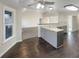 Lovely kitchen with eat-in island, stylish countertops, stainless steel faucet and hardwood floors at 1280 Pinyon Pl, Lawrenceville, GA 30043