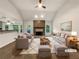 Bright living room with vaulted ceilings, fireplace, and ample seating at 1280 Pinyon Pl, Lawrenceville, GA 30043