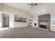Open-concept living area with fireplace and seamless flow to the kitchen at 1280 Pinyon Pl, Lawrenceville, GA 30043