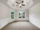 Sunlit living room with large windows and decorative trim at 1280 Pinyon Pl, Lawrenceville, GA 30043