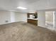 Open-concept living room flows to a functional kitchen and a full bathroom with a tiled shower at 1280 Pinyon Pl, Lawrenceville, GA 30043