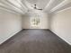 Spacious main bedroom featuring a decorative tray ceiling and large windows at 1280 Pinyon Pl, Lawrenceville, GA 30043