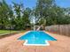 Large backyard swimming pool with a slide and gazebo at 1280 Pinyon Pl, Lawrenceville, GA 30043