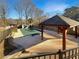 View of the backyard pool area, featuring a covered pool and gazebo at 1280 Pinyon Pl, Lawrenceville, GA 30043