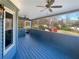 Comfortable screened porch with ceiling fans and backyard view for relaxing or entertaining at 1280 Pinyon Pl, Lawrenceville, GA 30043