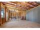 Unfinished basement with exposed framing and insulation, ready for customization at 2880 Ridge Manor Dr, Dacula, GA 30019