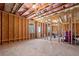 Unfinished basement with exposed framing and insulation, ready for customization at 2880 Ridge Manor Dr, Dacula, GA 30019