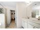 Bright bathroom with double vanity, large mirror, and a separate shower and walk-in closet at 2880 Ridge Manor Dr, Dacula, GA 30019