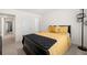 Bedroom featuring a large bed, modern light fixture, and connecting doorway at 2880 Ridge Manor Dr, Dacula, GA 30019