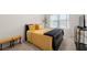 Bright bedroom with a large bed, yellow bedding, and decorative lighting fixture at 2880 Ridge Manor Dr, Dacula, GA 30019
