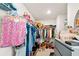 Organized walk-in closet with ample storage solutions for clothes, shoes, and accessories at 2880 Ridge Manor Dr, Dacula, GA 30019