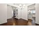 Elegant dining area with coffered ceiling, pendant lighting, and hardwood flooring at 2880 Ridge Manor Dr, Dacula, GA 30019