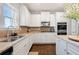 Modern kitchen featuring stainless steel appliances, granite counters, and ample cabinet space at 2880 Ridge Manor Dr, Dacula, GA 30019