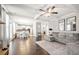 Open concept living space with hardwood floors, coffered ceilings, and seamlessly connected kitchen at 2880 Ridge Manor Dr, Dacula, GA 30019