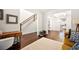 Open-concept living space with hardwood floors, staircase, and views to the kitchen at 2880 Ridge Manor Dr, Dacula, GA 30019