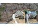 Aerial view of estate with large home, pool, and surrounding landscape at 2938 Summitop Ne Rd, Marietta, GA 30066