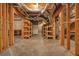 Unfinished basement space with exposed utilities and wooden shelving at 2938 Summitop Ne Rd, Marietta, GA 30066