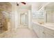 Luxurious primary bath with dual vanities, tile floors, and separate glass shower at 2938 Summitop Ne Rd, Marietta, GA 30066