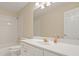 Bathroom featuring a white vanity, well lit mirror, and bath/shower combination at 2938 Summitop Ne Rd, Marietta, GA 30066