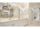 Beautiful bathroom featuring double sinks, white cabinets, and a glass-enclosed shower at 2938 Summitop Ne Rd, Marietta, GA 30066