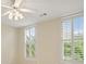 Bright bedroom featuring plantation shutters, ceiling fan, and neutral walls at 2938 Summitop Ne Rd, Marietta, GA 30066