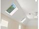 Bedroom with skylights provides ample natural light and has a ceiling fan at 2938 Summitop Ne Rd, Marietta, GA 30066