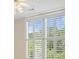 Bedroom featuring plantation shutters, ceiling fan, and neutral walls at 2938 Summitop Ne Rd, Marietta, GA 30066